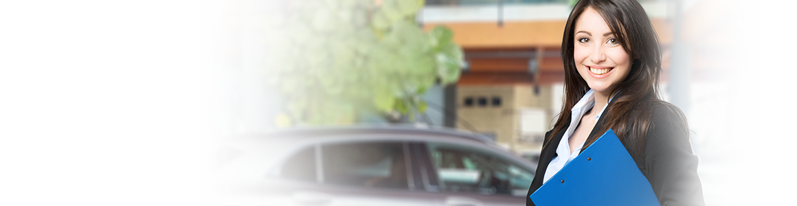 woman standing in front of car